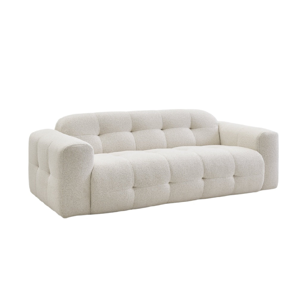 Moderne, cremefarbene Sofa mit tufted Design und bequemen Armlehnen